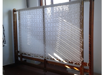 Stiratura professionale a telaio per tovaglie e lenzuola